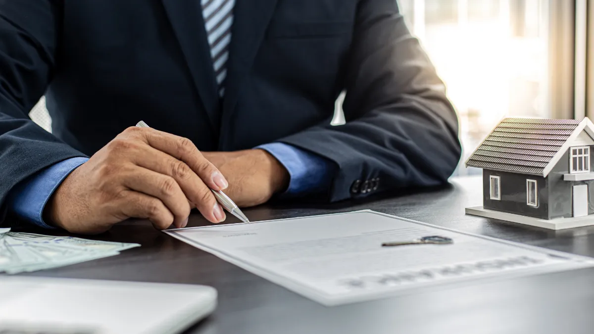 A property management agreement being signed